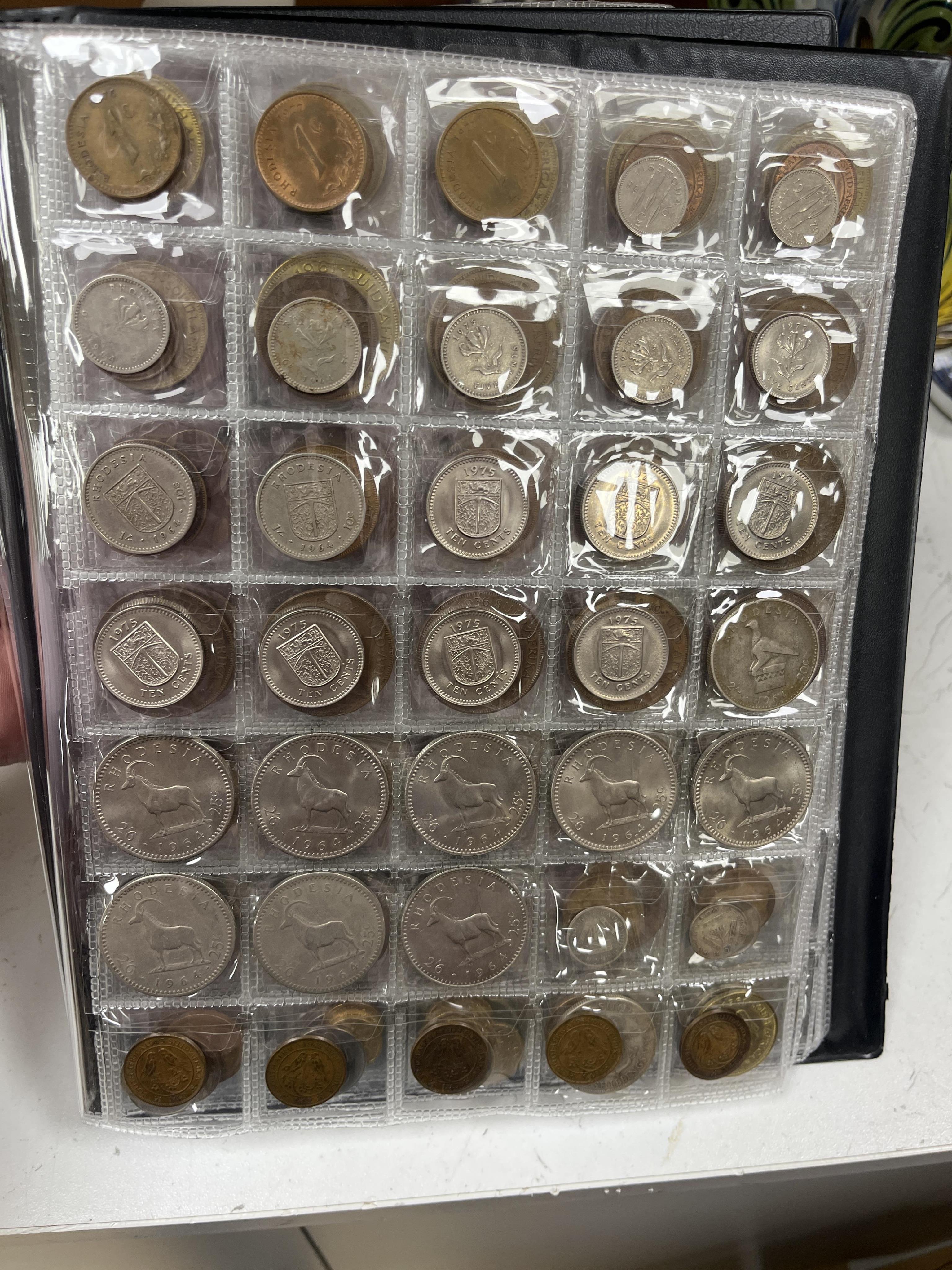 Southern Rhodesia, South Africa and Europe coins, early to late 20th century, and Victoria, and later pennies, Rhodesia, Japan, Zimbabwea banknotes, in two albums